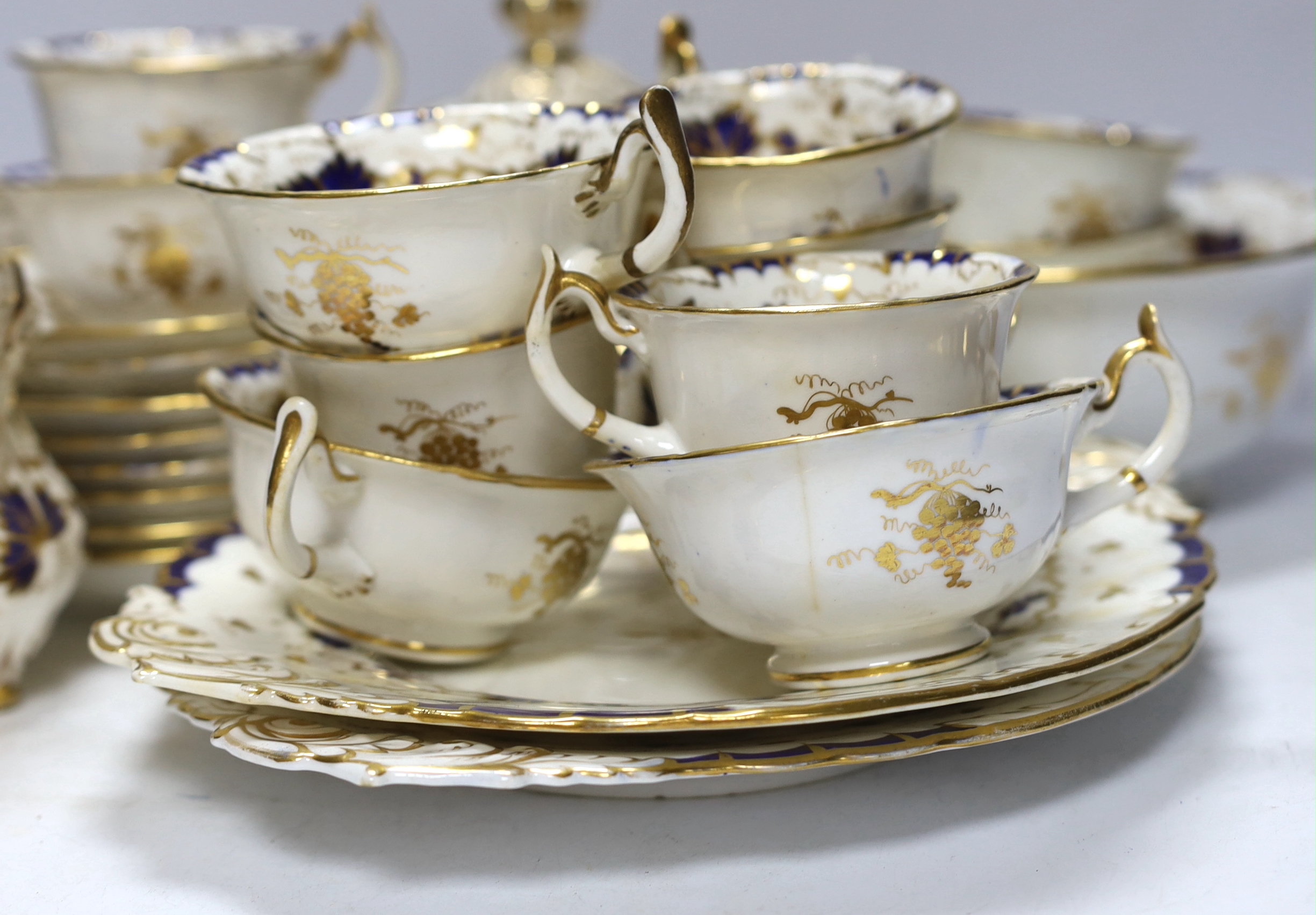 A mid 19th century Ridgeway style blue and gilt vine pattern twenty six piece part tea set